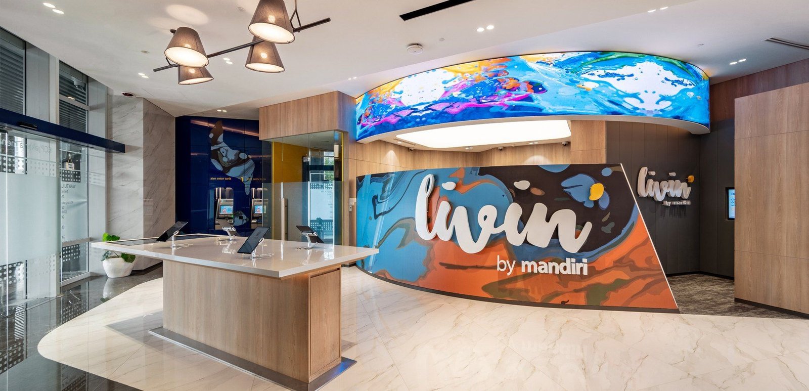 Livin PIK banking hall with illuminated sign and LED ceiling